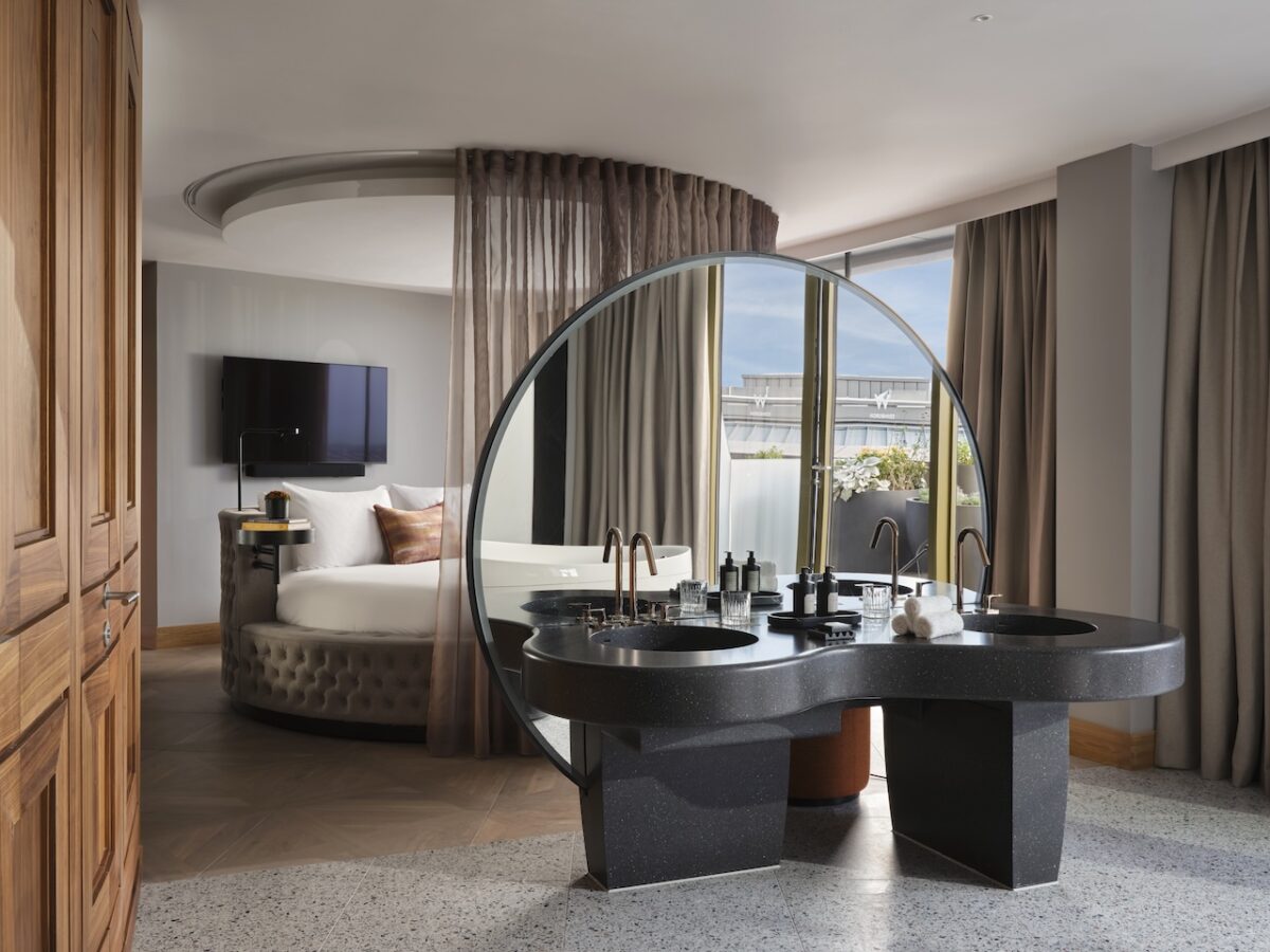 The WOW Suite bedroom with playful round bed and open plan vanity area (Photo Credit: Davide Lovatti)