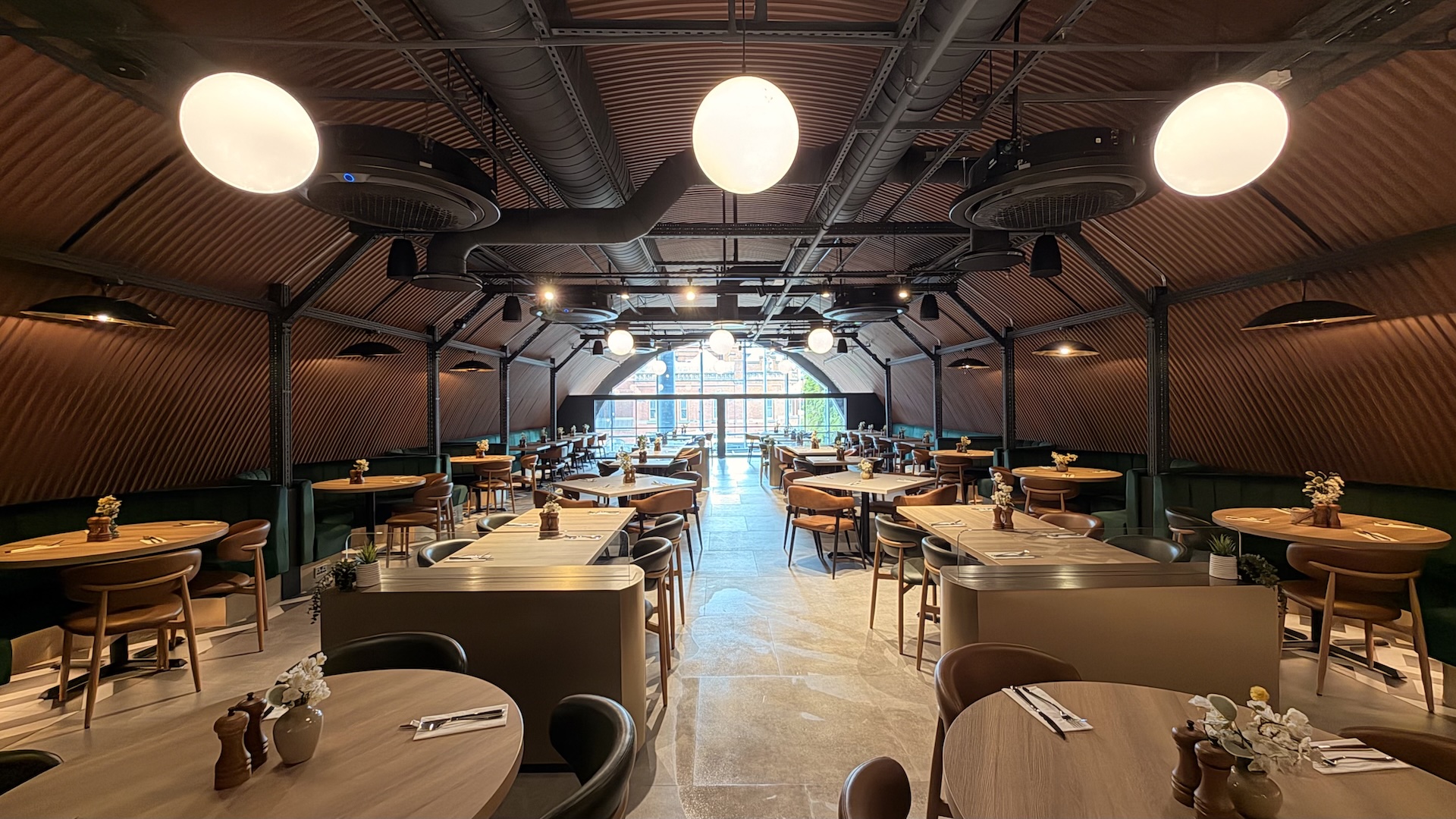 The dining room space is impressive with comfy banquette seating and central tables