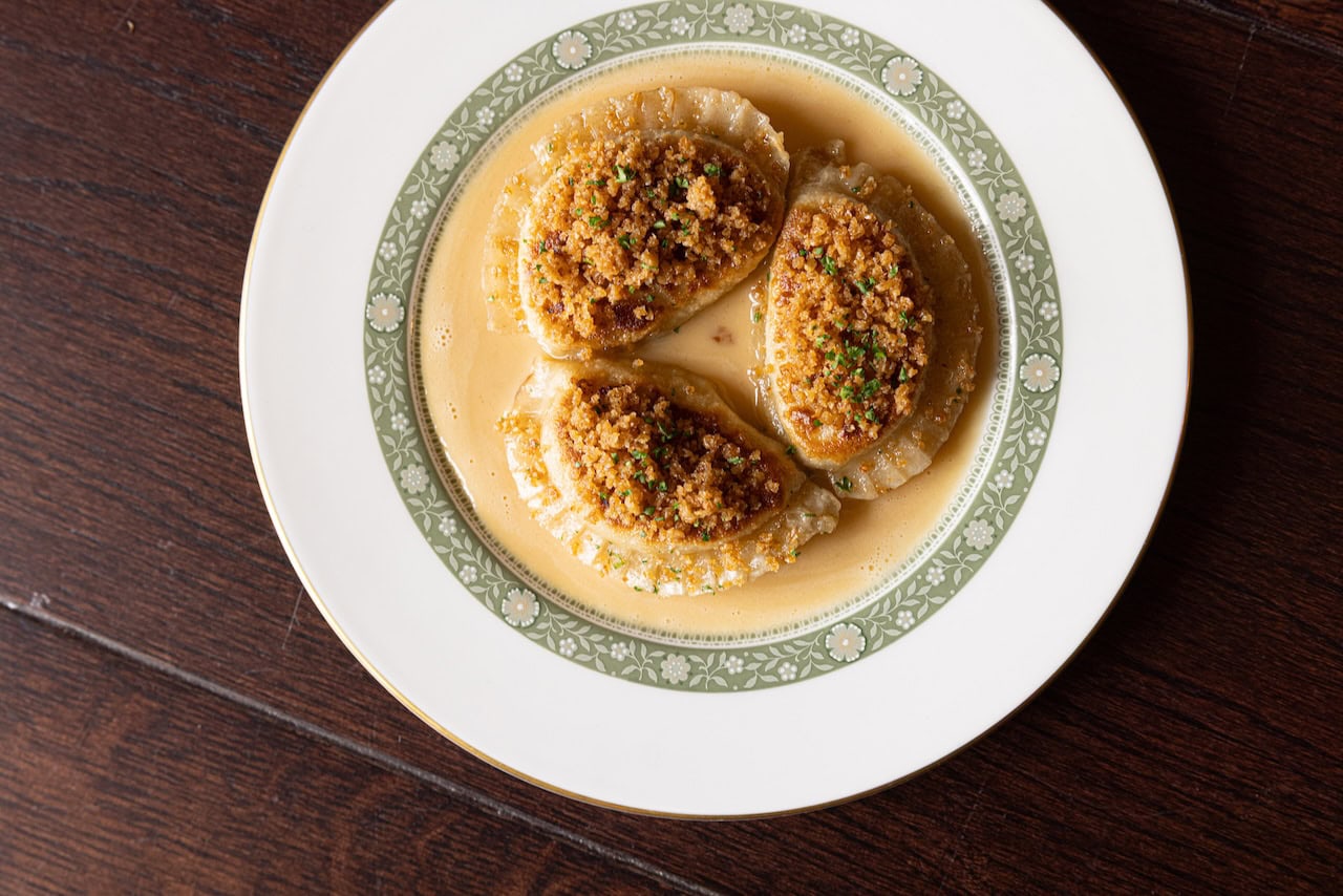Biedronka - Pierogi Ruskie – dumplings filled with farmer’s cheese, potatoes and onion, served with brown butter and cheese sauce, toasted breadcrumbs and parsley Credit Sean Elliott Photography3