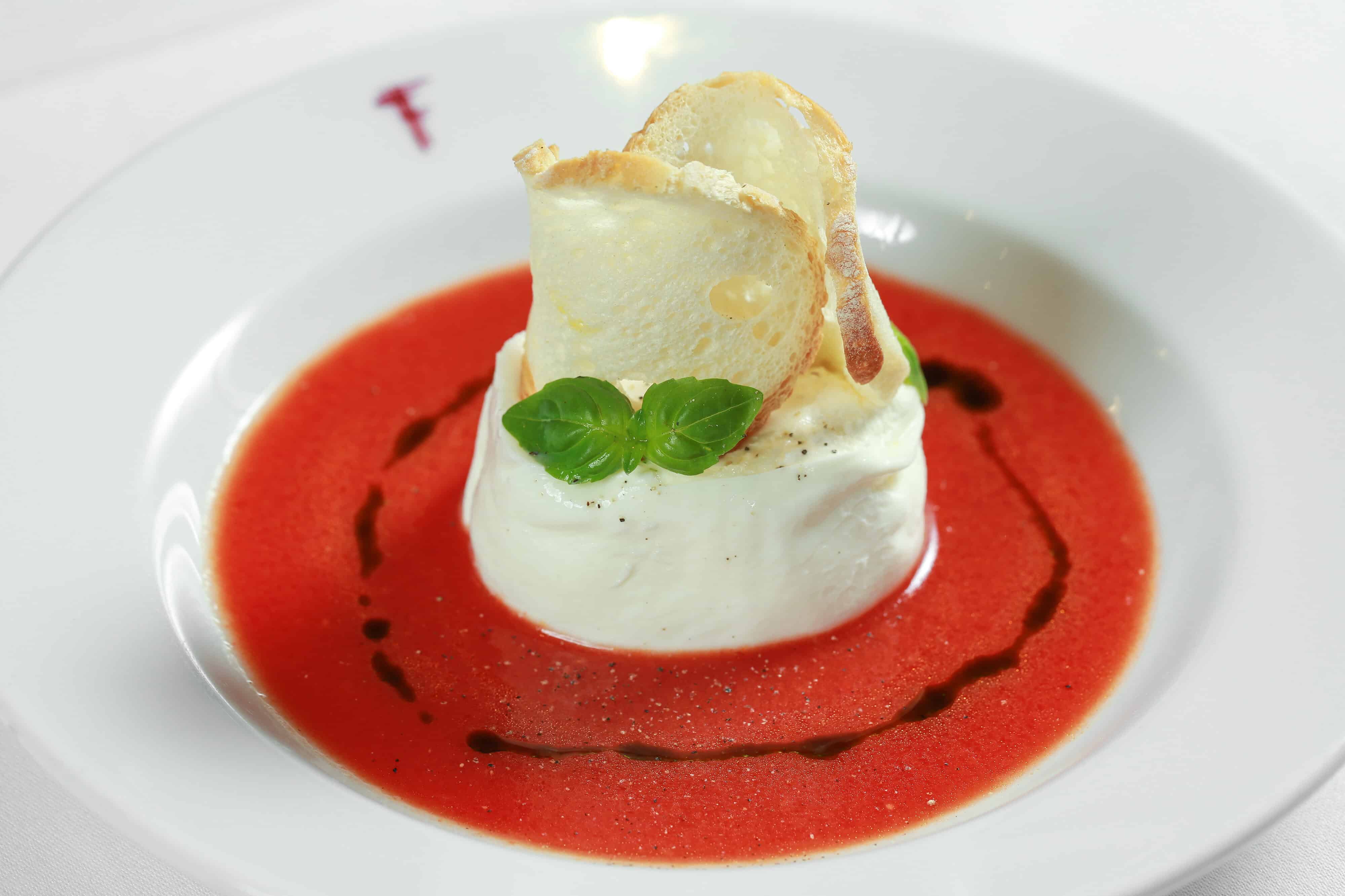 Franco's brand new vegan and vegetarian menu includes burrata with chilled tomato gazpacho and basil oil (V)