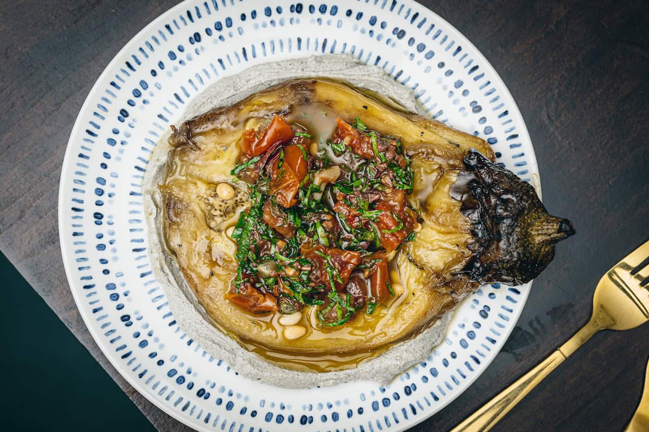 A Pascor signature - Burnt Aubergine with black tahini, pine nuts, pickled tomatoes and mint (Photo Credit: Lateef.photography)