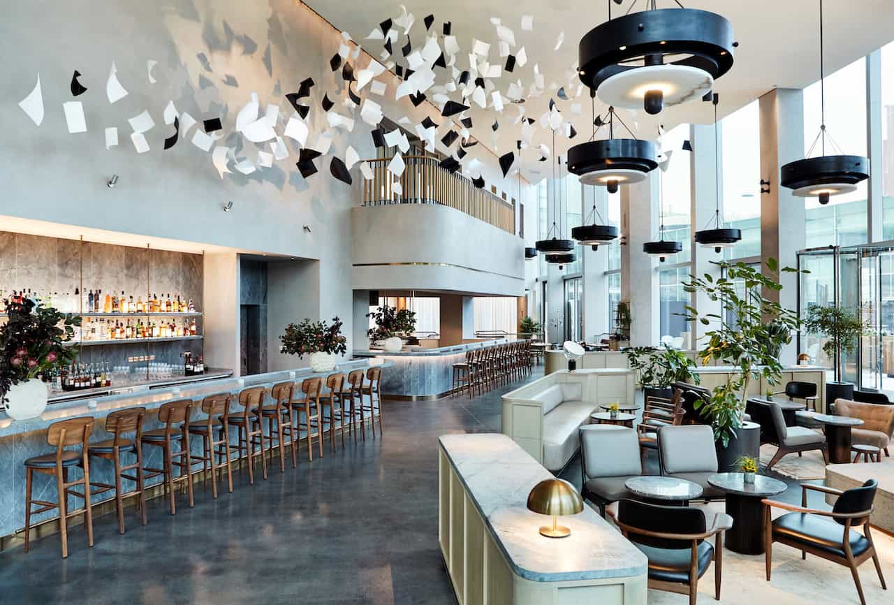 The epitome of the design hotel - The Stratford Hotel's triple height lobby and bar area (Photography by Sam Harris)