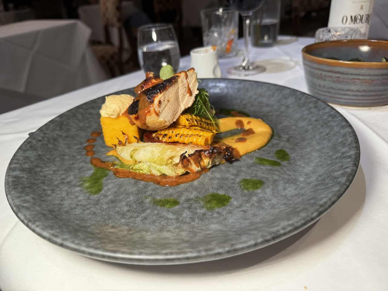 Corn fed chicken with fresh sweetcorn, charred cabbage, and blue cheese