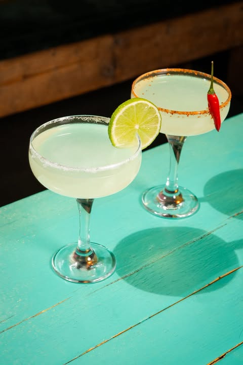 2 margaritas on a green table at Motel Mexicana