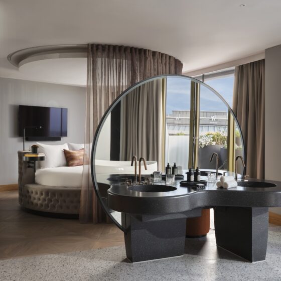 The WOW Suite bedroom with playful round bed and open plan vanity area (Photo Credit: Davide Lovatti)