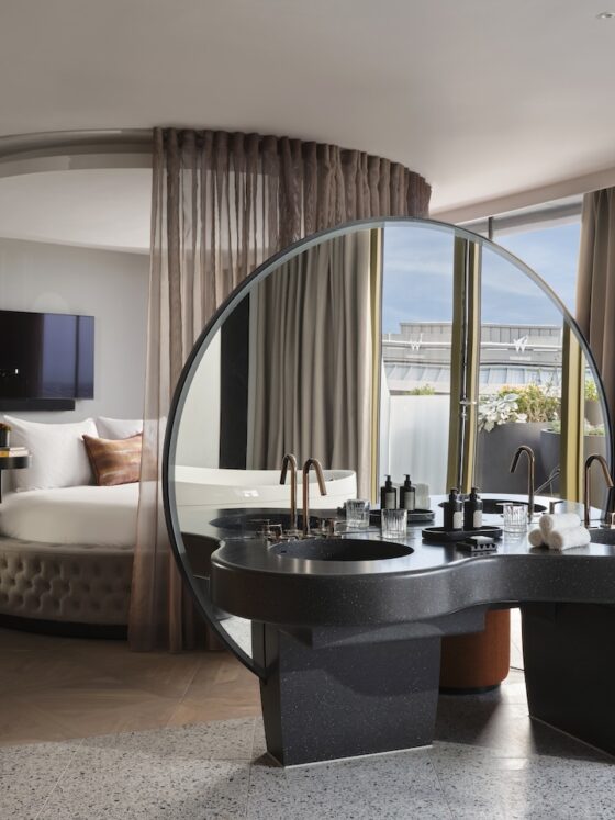 The WOW Suite bedroom with playful round bed and open plan vanity area (Photo Credit: Davide Lovatti)