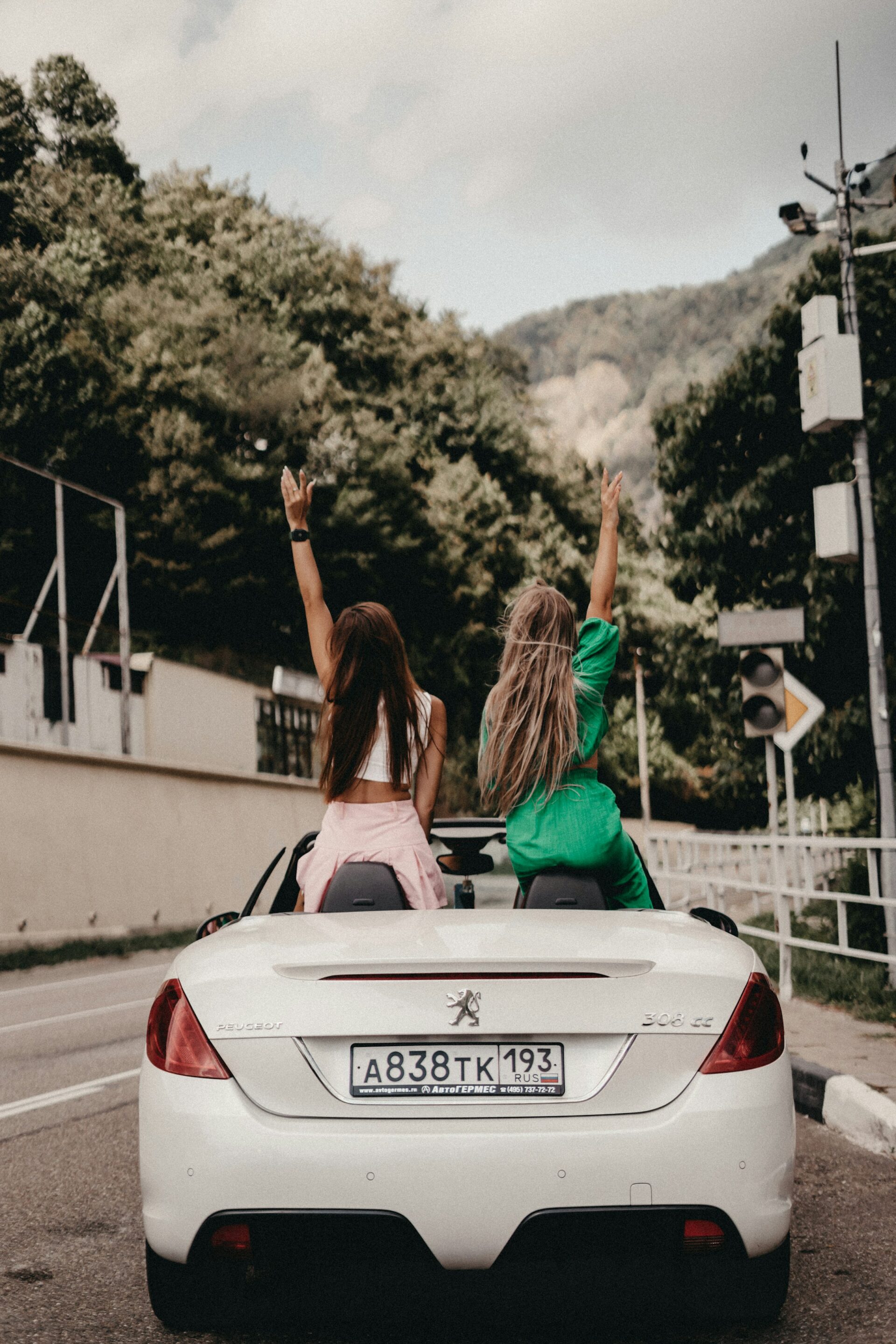 Girls on a road trip in a Peugeot