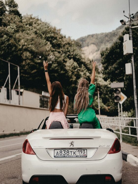 Girls on a road trip in a Peugeot