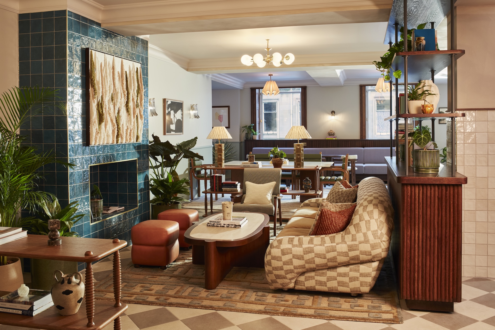 The lobby at The Hoxton Edinburgh featuring art on the walls, sofas and tables