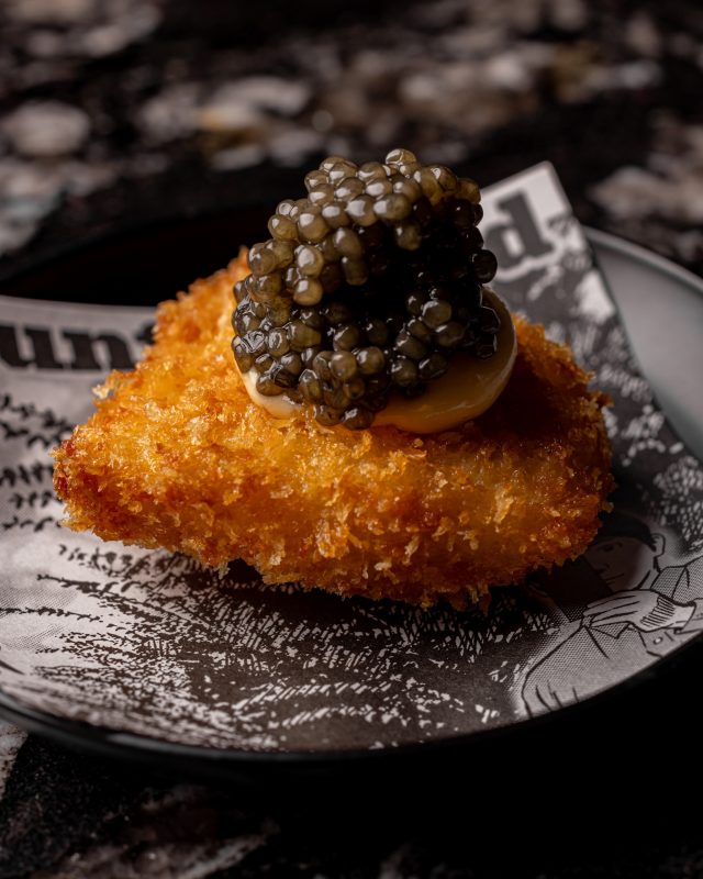 Chicken with a large dollop of caviar on the top at Bebe Bob