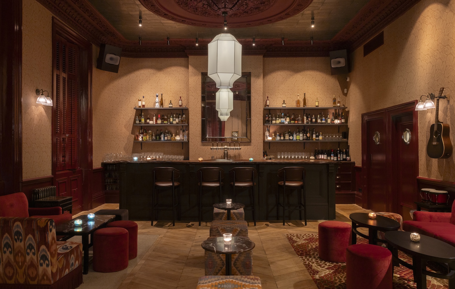 The bar area at The Good Oak complete with feature lighting and small tables