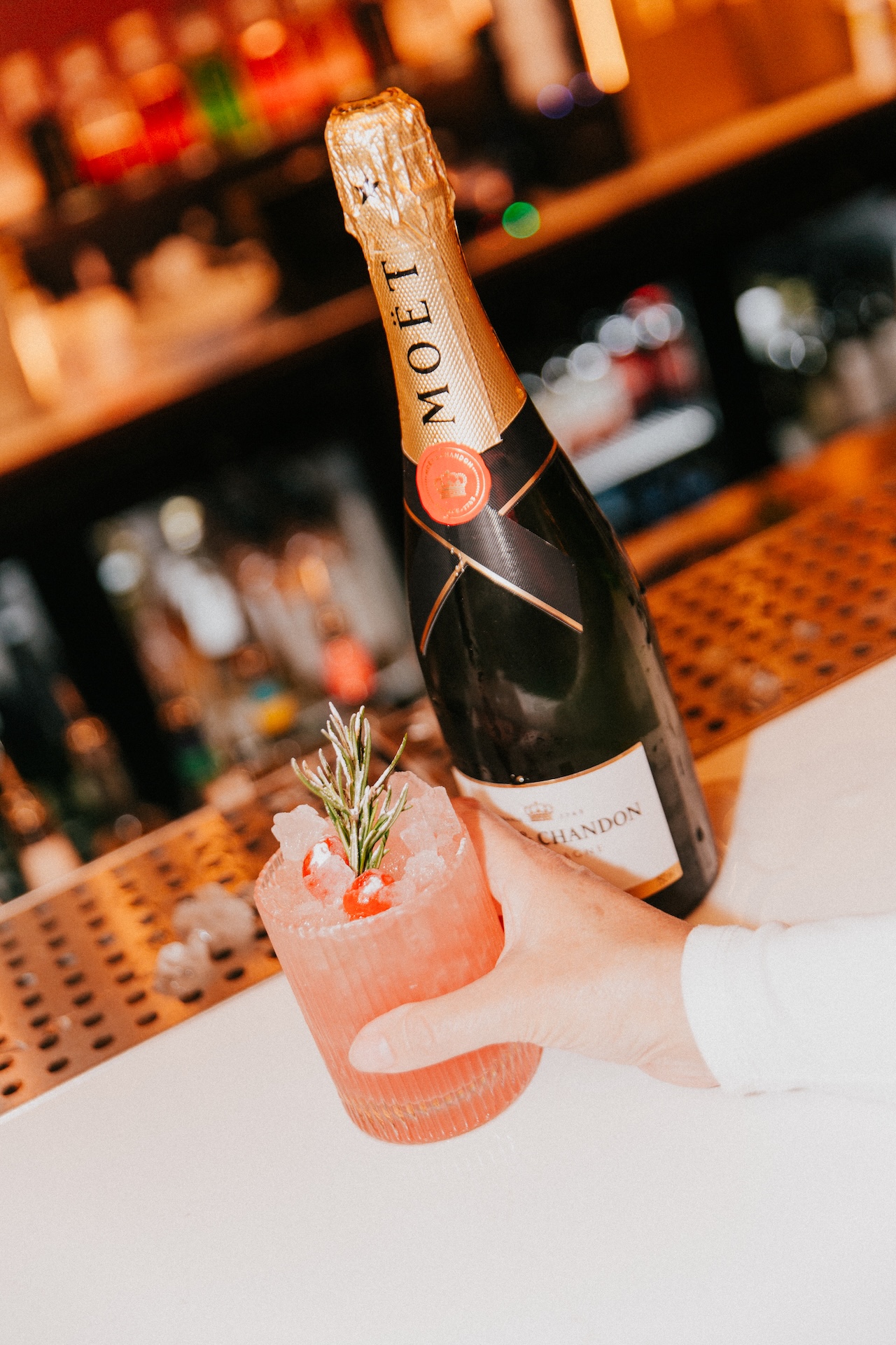 A bottle of Moet champagne and a cocktail at BAM Karaoke