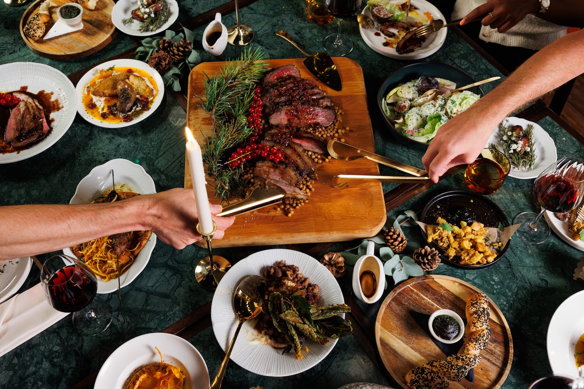 Kapara plate of meat up close as hands hold cutlery