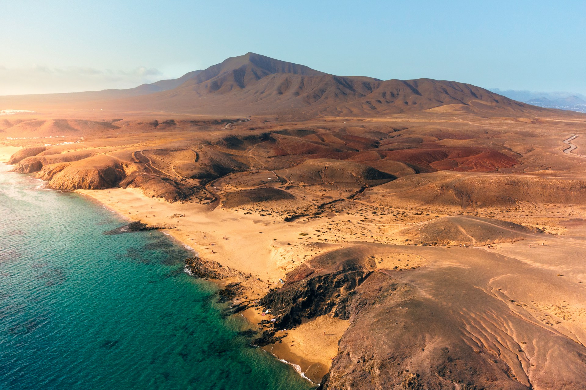 Lanzarote has a distinct landscape dominated by dark, volcanic earth (Photo Credit: Unsplash)