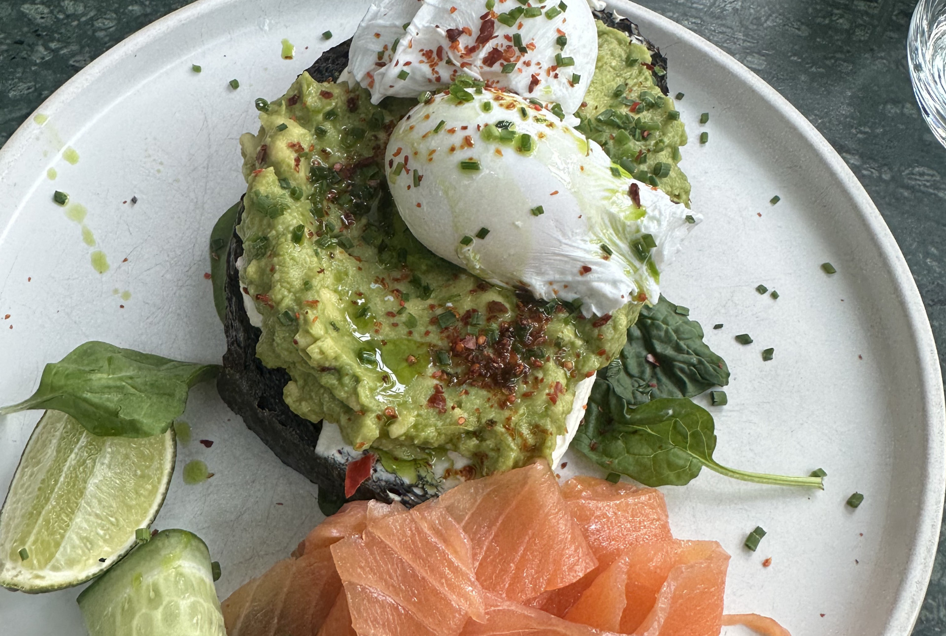 Avo on sourdough with a poached egg and salmon at Timmy Green, Victoria