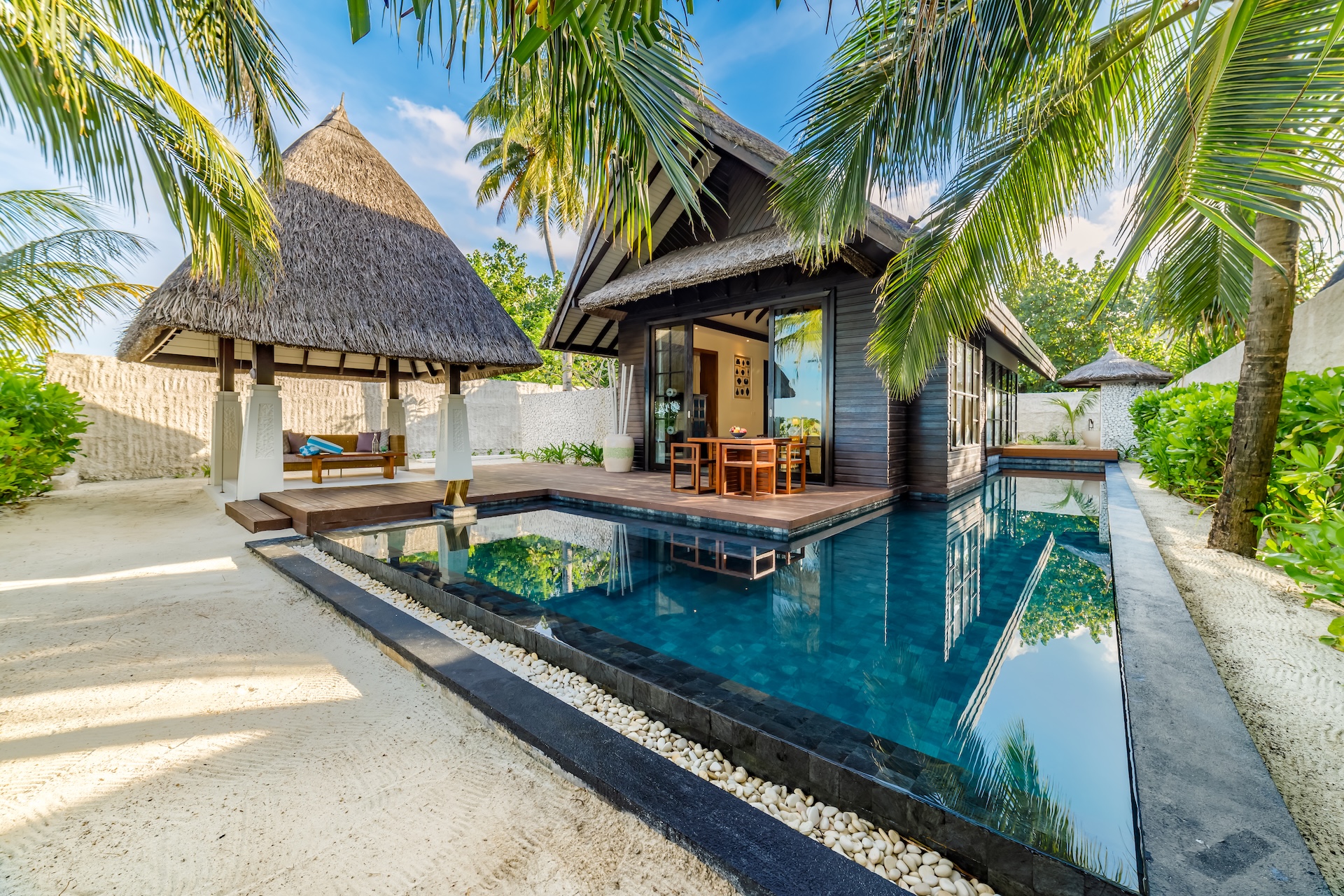 Our villa boasted a gorgeous private pool hidden amid lush greenery with an outdoor tub and covered cabana